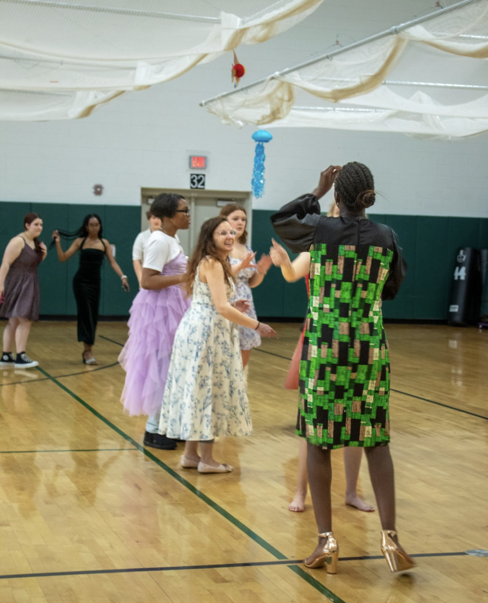 Teacher Lauren Adair dances with the students.